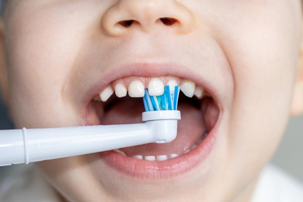 Kid Holding Toothbrush